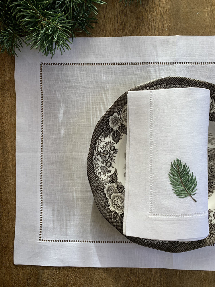 Linserviett med grankvist